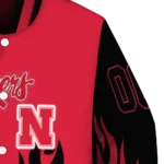 customized nebraska cornhuskers flame border red black varsity jacket best selling.webp