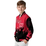 customized nebraska cornhuskers flame border red black varsity jacket best selling.webp