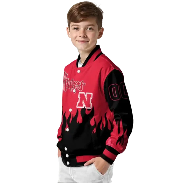 customized nebraska cornhuskers flame border red black varsity jacket trendy.webp