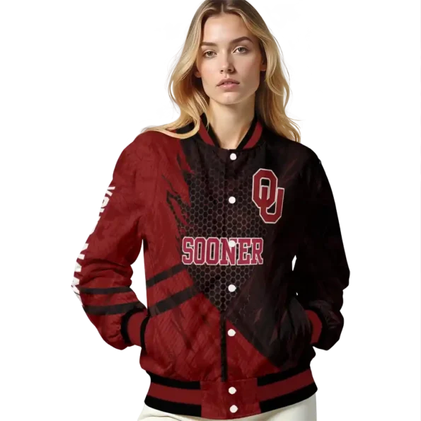 personalized oklahoma sooners hexagon mesh crimson black varsity jacket latest model.webp