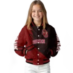 personalized oklahoma sooners hexagon mesh crimson black varsity jacket best selling.webp