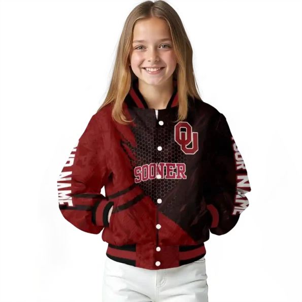 personalized oklahoma sooners hexagon mesh crimson black varsity jacket top rated.webp