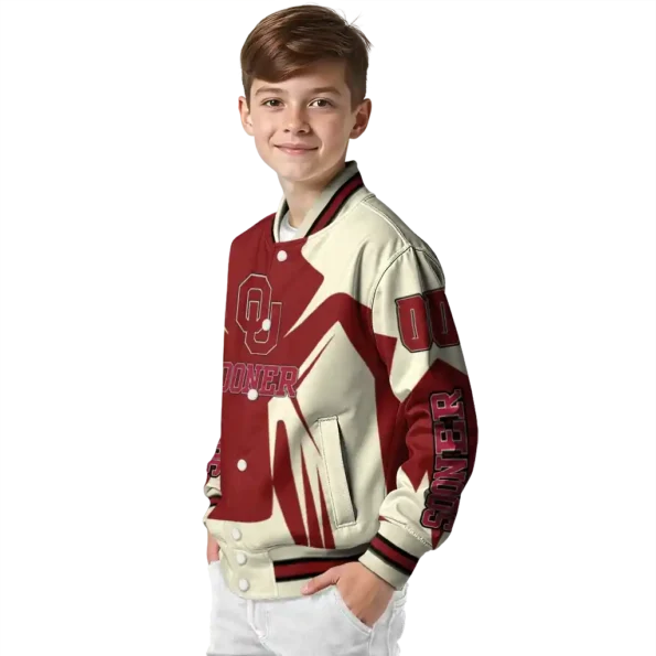 personalized oklahoma sooners spider mark crimson cream varsity jacket trendy.webp