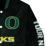 personalized-oregon-ducks-hexagon-mesh-green-black-varsity-jacket-best-selling.webp