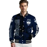 personalized uconn huskies hexagon cluster blue black varsity jacket best selling.webp