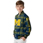 custom-michigan-wolverines-bolt-stripe-blue-varsity-jacket-best-selling.webp