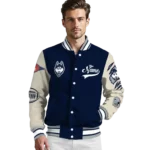 custom-uconn-huskies-wildcat-pawprint-blue-nude-varsity-jacket-best-selling.webp