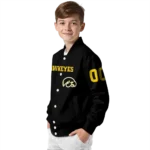 customized-iowa-hawkeyes-flame-border-black-varsity-jacket-best-selling.webp