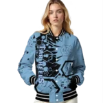 customized-north-carolina-tar-heels-hexagon-cluster-light-blue-black-varsity-jacket-best-selling.webp