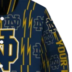 customized-notre-dame-fighting-irish-bolt-stripe-navy-varsity-jacket-best-selling.webp