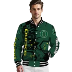 customized-oregon-ducks-hexagon-cluster-green-black-varsity-jacket-best-selling.webp