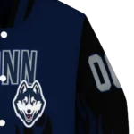 customized-uconn-huskies-flame-border-blue-black-varsity-jacket-best-selling.webp