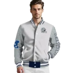 customized-uconn-huskies-speckled-arms-blue-gray-varsity-jacket-best-selling.webp