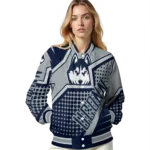 customized-uconn-huskies-star-burst-blue-varsity-jacket-best-selling.webp