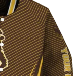 customized-wyoming-cowboys-chevron-arrow-brown-varsity-jacket-best-selling.webp