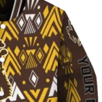 customized-wyoming-cowboys-pyramid-shapes-brown-varsity-jacket-best-selling.webp
