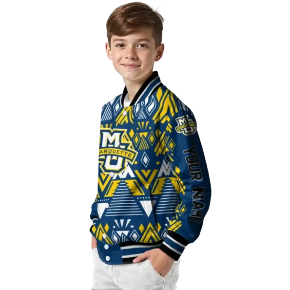 personalized marquette golden eagles pyramid shapes blue varsity jacket trendy.webp