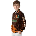 personalized-miami-hurricanes-hexagon-mesh-orange-black-varsity-jacket-best-selling.webp