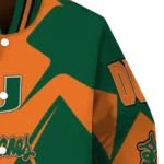 personalized-miami-hurricanes-spider-mark-orange-green-varsity-jacket-best-selling.webp
