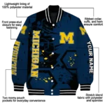 personalized-michigan-wolverines-hexagon-cluster-blue-black-varsity-jacket-best-selling.webp