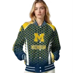 personalized michigan wolverines hexagon grid blue varsity jacket best selling.webp