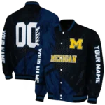 personalized-michigan-wolverines-hexagon-mesh-blue-black-varsity-jacket-best-selling.webp
