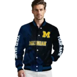 personalized-michigan-wolverines-hexagon-mesh-blue-black-varsity-jacket-best-selling.webp
