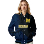 personalized-michigan-wolverines-hexagon-mesh-blue-black-varsity-jacket-best-selling.webp