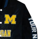personalized-michigan-wolverines-hexagon-mesh-blue-black-varsity-jacket-best-selling.webp