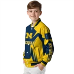 personalized-michigan-wolverines-spider-mark-blue-maize-varsity-jacket-best-selling.webp