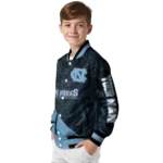 personalized-north-carolina-tar-heels-hexagon-mesh-light-blue-black-varsity-jacket-best-selling.webp