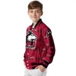 personalized-northern-illinois-huskies-bolt-stripe-red-varsity-jacket-best-selling.webp