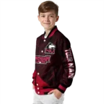 personalized-northern-illinois-huskies-hexagon-mesh-red-black-varsity-jacket-best-selling.webp