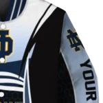 personalized-notre-dame-fighting-irish-mesh-effect-navy-black-varsity-jacket-best-selling.webp