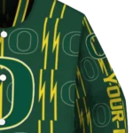 personalized-oregon-ducks-bolt-stripe-green-varsity-jacket-best-selling.webp