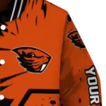 personalized-oregon-state-beavers-hexagon-cluster-orange-black-varsity-jacket-best-selling.webp