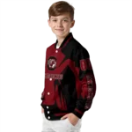 personalized-south-carolina-gamecocks-spider-mark-garnet-black-varsity-jacket-best-selling.webp