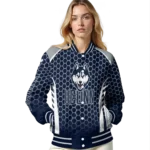 personalized-uconn-huskies-hexagon-grid-blue-varsity-jacket-best-selling.webp