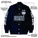 personalized-uconn-huskies-hexagon-mesh-blue-black-varsity-jacket-best-selling.webp