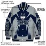personalized-uconn-huskies-spider-mark-blue-grey-varsity-jacket-best-selling.webp