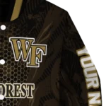 personalized-wake-forest-demon-deacons-hexagon-mesh-gold-black-varsity-jacket-best-selling.webp