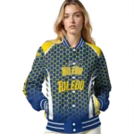 customized-toledo-rockets-hexagon-grid-blue-varsity-jacket-best-selling.webp