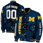 personalized-michigan-wolverines-hexagon-cluster-blue-black-varsity-jacket-best-selling.webp