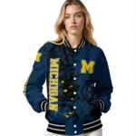 personalized-michigan-wolverines-hexagon-cluster-blue-black-varsity-jacket-best-selling.webp
