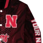 personalized-nebraska-cornhuskers-hexagon-mesh-red-black-varsity-jacket-best-selling.webp