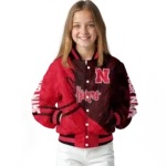 personalized-nebraska-cornhuskers-hexagon-mesh-red-black-varsity-jacket-best-selling.webp
