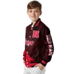 personalized-nebraska-cornhuskers-hexagon-mesh-red-black-varsity-jacket-best-selling.webp