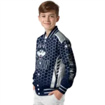 personalized-uconn-huskies-hexagon-grid-blue-varsity-jacket-best-selling.webp