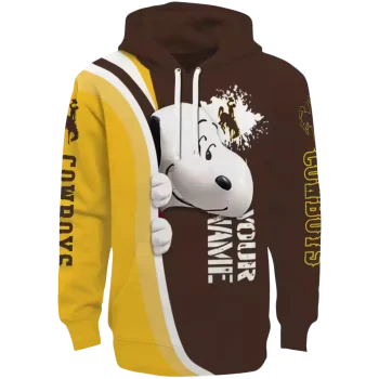 customized wyoming cowboys peeking snoopy brown hoodie best selling