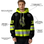 customized wyoming cowboys safety motif black neon green hoodie best selling